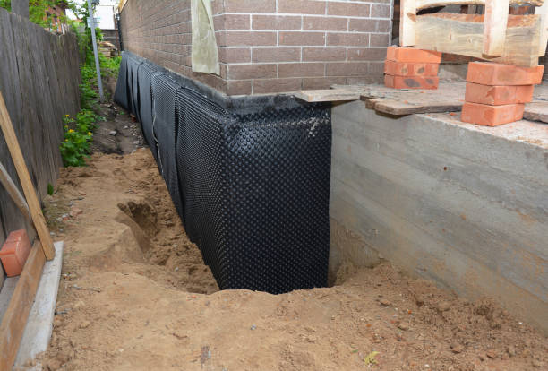 Happy homeowners after waterproofing job in Waterville
